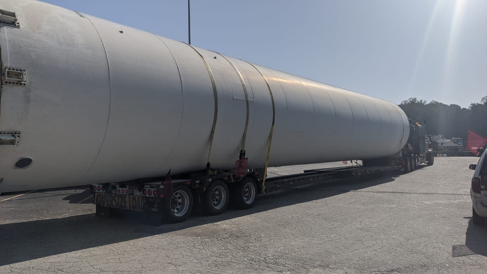 Grain silo being hauled on a trailer