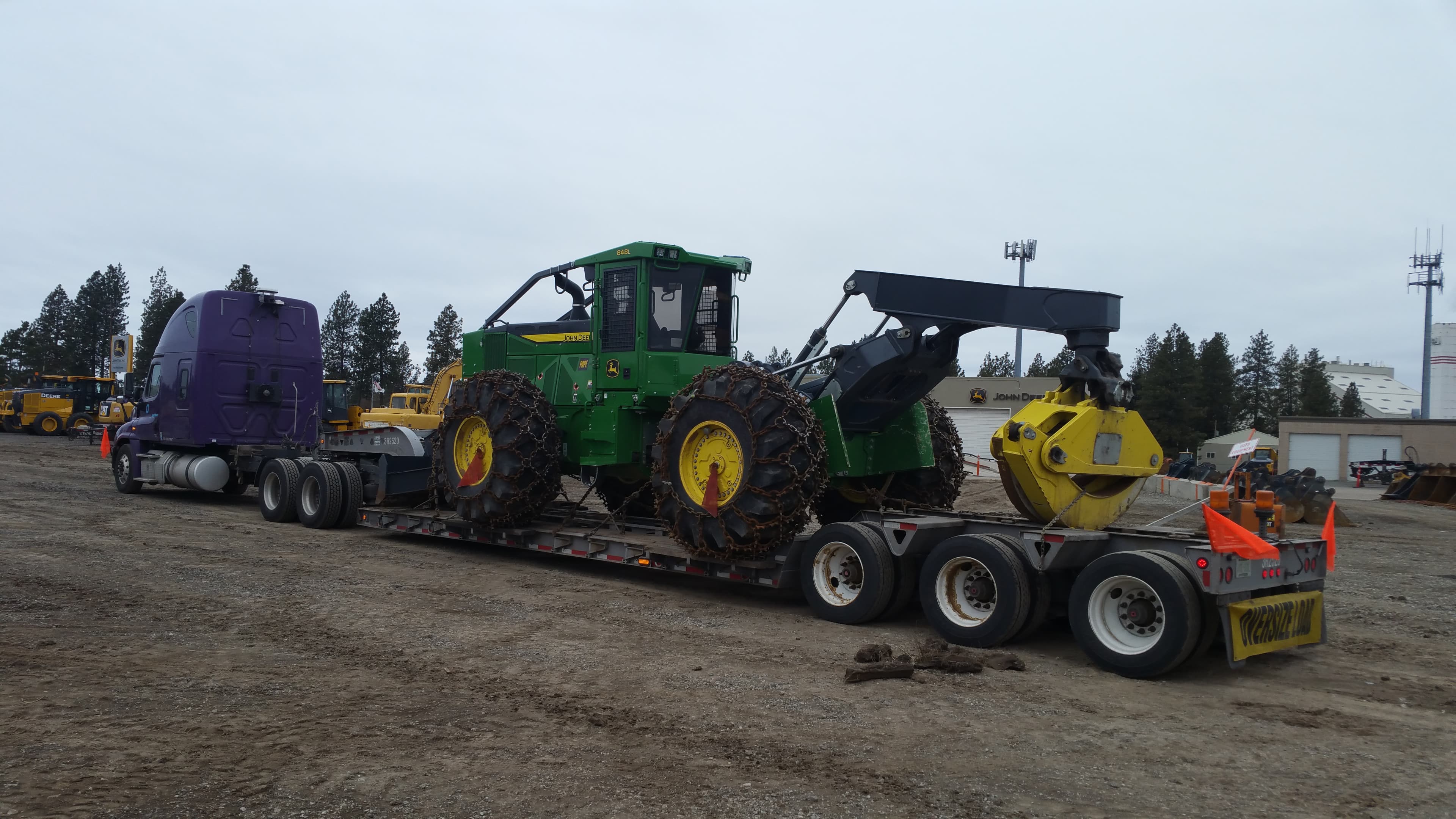 John Deere 648L wheel loader loaded for transport